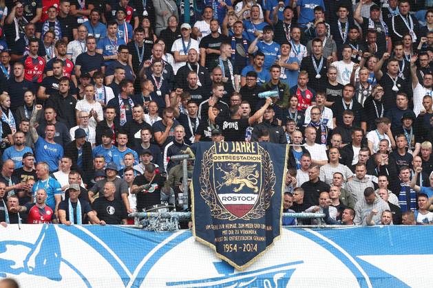 18.08.2024, xtgx, Fussball DFB Pokal 1. Runde, FC Hansa Rostock - Hertha BSC Berlin emspor, v.l. Symbolfoto, Symbolbild, Symbol Fans, Zuschauer, Publikum, Tribuene Rostock (DFL DFB REGULATIONS PROHIBIT ANY USE OF PHOTOGRAPHS as IMAGE SEQUENCES and or QUASI-VIDEO) Rostock
