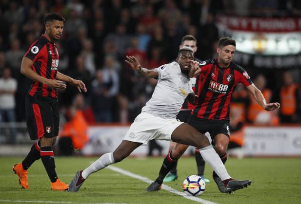 AFC Bournemouth v Manchester United, ManU - Premier League - Vitality Stadium April 18, 2018 - Bournemouth, United Kingdom - Paul Pogba of Manchester United goes down under a tackle by Andrew Surman of Bournemouth during the premier league match at the Vitality Stadium, Bournemouth. Picture date 18th April 2018. Picture credit should read: David Klein Sportimage Bournemouth United Kingdom EDITORIAL USE ONLY Copyright: xx ZUMA-20180418_zaf_si1_061.jpg DavidxKleinx csmphototwo392149