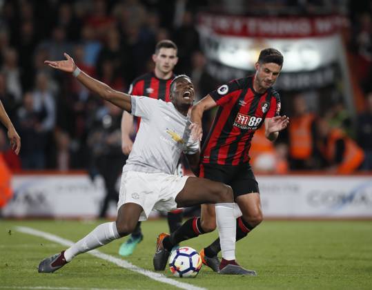 AFC Bournemouth v Manchester United, ManU - Premier League - Vitality Stadium April 18, 2018 - Bournemouth, United Kingdom - Paul Pogba of Manchester United goes down under a tackle by Andrew Surman of Bournemouth during the premier league match at the Vitality Stadium, Bournemouth. Picture date 18th April 2018. Picture credit should read: David Klein Sportimage Bournemouth United Kingdom EDITORIAL USE ONLY Copyright: xx ZUMA-20180418_zaf_si1_059.jpg DavidxKleinx csmphototwo392157