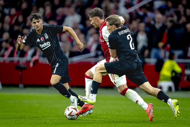 AFC Ajax Amsterdam forwarder Mika Godts, Besiktas JK defender Jonas Svensson, during the match Ajax - Besiktas at the Johan Cruijff ArenA for the UEFA Europa League - League phase - Matchday 1 season 2024-2025 in AMSTERDAM, Netherlands on 26 september 2024, (photo by Marcel van Dorst EYE4images DeFodi Images) Defodi-746_190846