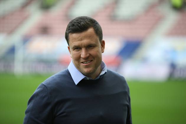 Wigan Athletic v Exeter City EFL Sky Bet League 1 28 09 2024. Exeter City Manager Gary Caldwell smiling during the EFL Sky Bet League 1 match between Wigan Athletic and Exeter City at the Brick Community Stadium, Wigan, England on 28 September 2024. Wigan Brick Community Stadium Greater Manchester England Editorial use only DataCo restrictions apply See www.football-dataco.com , Copyright: xJohnxBradleyx PSI-20514-0006