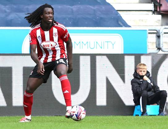 Wigan Athletic v Exeter City EFL Sky Bet League 1 28 09 2024. Exeter City defender Johnly Yfeko (15) ith ball during the EFL Sky Bet League 1 match between Wigan Athletic and Exeter City at the Brick Community Stadium, Wigan, England on 28 September 2024. Wigan Brick Community Stadium Greater Manchester England Editorial use only DataCo restrictions apply See www.football-dataco.com , Copyright: xJohnxBradleyx PSI-20514-0025
