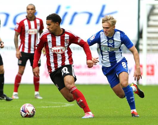 Wigan Athletic v Exeter City EFL Sky Bet League 1 28 09 2024. Exeter City midfielder Kamari Doyle (20) and Wigan Athletic midfielder Matt Smith (8) during the EFL Sky Bet League 1 match between Wigan Athletic and Exeter City at the Brick Community Stadium, Wigan, England on 28 September 2024. Wigan Brick Community Stadium Greater Manchester England Editorial use only DataCo restrictions apply See www.football-dataco.com , Copyright: xJohnxBradleyx PSI-20514-0038
