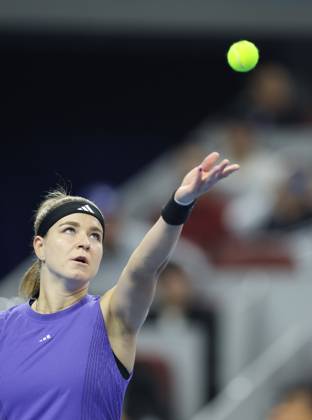 (241005) -- BEIJING, Oct. 5, 2024 -- Karolina Muchova of the Czech Republic serves during the women s singles semifinal match against Zheng Qinwen of China at 2024 China Open tennis tournament in Beijing, capital of China, Oct. 5, 2024. (Photo by Xinhua) (SP)CHINA-BEIJING-TENNIS-CHINA OPEN-WOMEN S SINGLES(CN) DuxXinyi