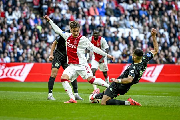 AFC Ajax Amsterdam forwarder Mika Godts, FC Groningen defender Marco Rente, during the match Ajax - Groningen at the Johan Cruijff ArenA for the Dutch eredivisie season 2024-2025 in AMSTERDAM, Netherlands on 6 oktober 2024, (photo by Stefan Koops EYE4images DeFodi Images) Defodi-746_193554