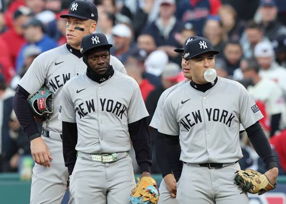 New York Yankees Aaron Judge, Jazz Chisholm Jr. and Anthony Volpe wait for a review of Cleveland Guardians Jose Ramirez stealing second in the third inning in game three of the MLB, Baseball Herren, USA ALCS at Progressive Field in Cleveland, Ohio, on Thursday, October 17, 2024.  CLE20241017820 AARONxJOSEFCZYK