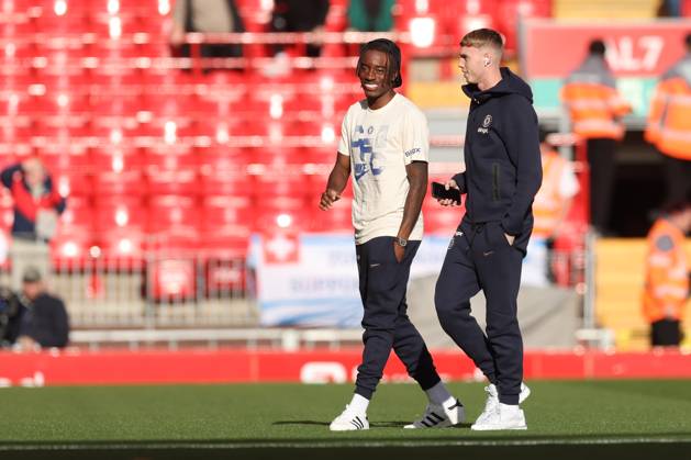 Football - 2024 2025 Premier League - Liverpool v Chelsea - Anfield - Sunday 20th October 2024 Cole Palmer of Chelsea walks the pitch before the start of the match with Noni Madueke