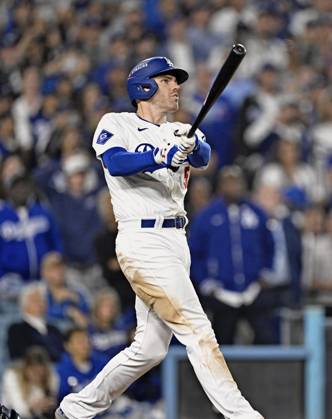 Baseball: World Series Freddie Freeman of the Los Angeles Dodgers hits a walk-off grand slam in the 10th inning of Game 1 of the World Series against the New York Yankees at Dodger Stadium in Los Angeles on Oct. 25, 2024.  A14AA0003639528P