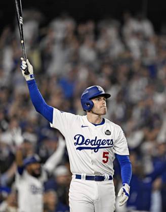 Baseball: World Series Freddie Freeman of the Los Angeles Dodgers reacts after hitting a walk-off grand slam in the 10th inning of Game 1 of the World Series against the New York Yankees at Dodger Stadium in Los Angeles on Oct. 25, 2024.  A14AA0003639555P