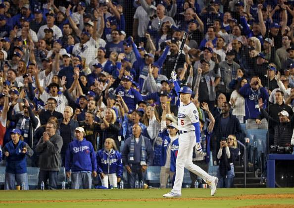 Baseball: World Series Freddie Freeman of the Los Angeles Dodgers reacts after hitting a walk-off grand slam in the 10th inning of Game 1 of the World Series against the New York Yankees at Dodger Stadium in Los Angeles on Oct. 25, 2024.  A14AA0003639662P