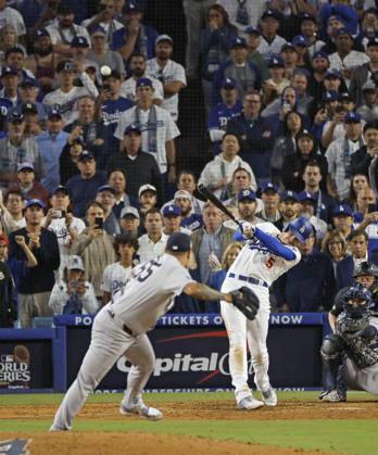 Baseball: World Series Freddie Freeman of the Los Angeles Dodgers hits a walk-off grand slam in the 10th inning of Game 1 of the World Series against the New York Yankees at Dodger Stadium in Los Angeles on Oct. 25, 2024.  A14AA0003639706P