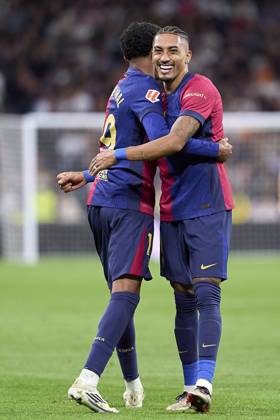 Lamine Yamal of FC Barcelona, Barca celebrates with Raphinha of FC Barcelona after scoring his team s third goal during the LaLiga EA Sports match between Real Madrid CF and FC Barcelona at Estadio Santiago Bernabeu on October 26, 2024 in Madrid, Spain. (Photo by: LGM Panoramic) FOOTBALL : Real Madrid CF vs FC Barcelona- LaLiga EA Sports - 26 10 2024 LGM Panoramic