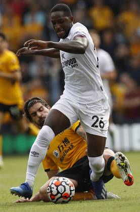 Wolverhampton Wanderers v Brentford - Premier League - Molineux September 18, 2021, Wolverhampton, United Kingdom: Wolverhampton, England, 18th September 2021. Ruben Neves of Wolverhampton Wanderers challenges Shandon Baptiste of Brentford during the Premier League match at Molineux, Wolverhampton. Picture credit should read: Darren Staples Sportimage Wolverhampton United Kingdom EDITORIAL USE ONLY Copyright: xx ZUMA-20210918_zaf_si1_021.jpg DarrenxStaplesx csmphototwo790504