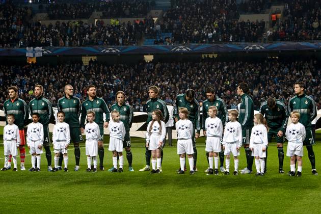 MANCHESTER, UNITED KINGDOM: 21 NOVEMBER 2012 Real Madrid players stand together with official UEFA Champions League mascots prior to the UEFA Champions League Group D soccer match between Manchester City and Real Madrid at the Etihad Stadium, United Kingdom on 21 November 2012. Manchester City FC v Real Madrid FC UCL_2012-2013