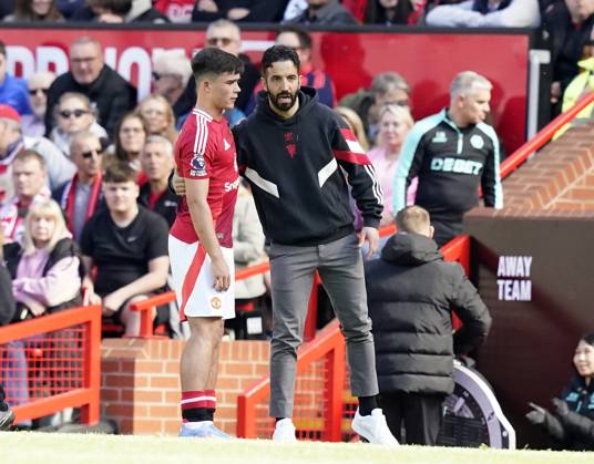 Manchester, England, 20th April 2025. Harry Amass of Manchester United, ManU (L) talks to Ruben Amorim manager of Manchester United during the Manchester United vs Wolverhampton Wanderers Premier League match at Old Trafford, Manchester. Picture credit should read: Andrew Yates Sportimage EDITORIAL USE ONLY. No use with unauthorised audio, video, data, fixture lists, club league logos or live services. Online in-match use limited to 120 images, no video emulation. No use in betting, games or single club league player publications. SPI_055_AY_MAN_UTD_WOLVES SPI-3852-0043