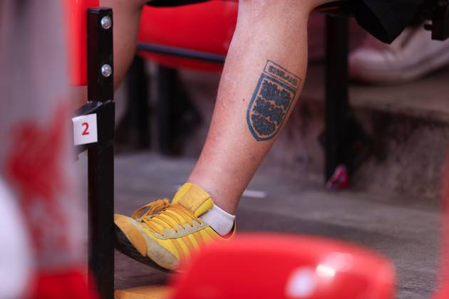 Liverpool FC v Arsenal FC - Premier League LIVERPOOL, ENGLAND - MAY 11: A three lions England badge tattoo is seen on a fan s leg during the Premier League match between Liverpool FC and Arsenal FC at Anfield on May 11, 2025 in Liverpool, England. (Photo by Simon Stacpoole Offside Offside via Getty Images) Liverpool England United Kingdom Copyright: xSimonxStacpoole OffsidexOffside 776173232