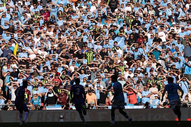 Crystal Palace v Manchester City 17 May 2025, London - FA Cup Final - Crystal Palace v Manchester City - City fans shield their eyes from the sun - Photo: Jacques Feeney Offside. London UK Copyright: xJacquesxFeeneyx xOffsidexOffside