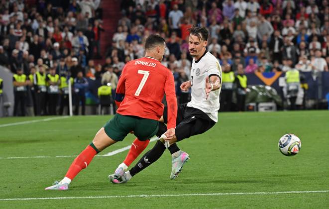 04.06.2025, xjrdrx, Fussball UEFA Nations League 1 2 Finale, Deutschland - Portugal v.l. Cristiano Ronaldo (Portugal), Robin Koch (Deutsche Fussball Nationalmannschaft DFB) (DFL DFB REGULATIONS PROHIBIT ANY USE OF PHOTOGRAPHS as IMAGE SEQUENCES and or QUASI-VIDEO) Muenchen