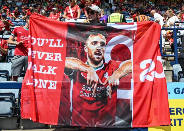 Preston, England, 13th July 2025. Liverpool fans holding a banner in tribute of Liverpool player Diogo Jota ahead of the Preston North End vs Liverpool Pre Season Friendly match at Deepdale, Preston. Picture credit should read: Cody Froggatt Sportimage EDITORIAL USE ONLY. No use with unauthorised audio, video, data, fixture lists, club league logos or live services. Online in-match use limited to 120 images, no video emulation. No use in betting, games or single club league player publications. SPI_017_CF_PRESTON_V_LIVERPOOL SPI-4018-0017