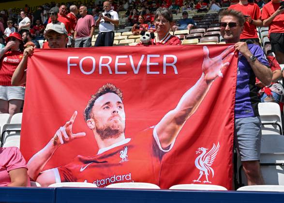Preston, England, 13th July 2025. Liverpool fans holding a banner in tribute of Liverpool player Diogo Jota ahead of the Preston North End vs Liverpool Pre Season Friendly match at Deepdale, Preston. Picture credit should read: Cody Froggatt Sportimage EDITORIAL USE ONLY. No use with unauthorised audio, video, data, fixture lists, club league logos or live services. Online in-match use limited to 120 images, no video emulation. No use in betting, games or single club league player publications. SPI_018_CF_PRESTON_V_LIVERPOOL SPI-4018-0018