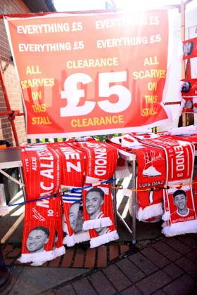 Football - Pre-Season Friendly - Liverpool v Athletic Bilbao 4th August 2025 - Pre-Season Friendly - Liverpool v Athletic Bilbao - A souvenir scarf featuring the face of former Liverpool player Trent Alexander-Arnold is seen in the clearance section of a merchandise stall - Photo: Simon Stacpoole Offside. Liverpool UK Copyright: xSimonxStacpoolexOffside