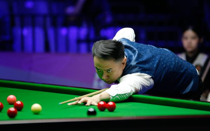 WUHAN, CHINA - AUGUST 24: Xiao Guodong of China plays a shot in the first round match against Mink Nutcharut of Thailand on day 1 of the 2025 Wuhan Open Qualifiers at Optics Valley Gymnasium of HUST on August 24, 2025 in Wuhan, Hubei Province of China. Copyright: xTaixChengzhex 111586616983