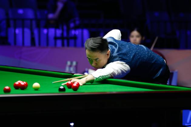 WUHAN, CHINA - AUGUST 24: Xiao Guodong of China plays a shot in the first round match against Mink Nutcharut of Thailand on day 1 of the 2025 Wuhan Open Qualifiers at Optics Valley Gymnasium of HUST on August 24, 2025 in Wuhan, Hubei Province of China. Copyright: xTaixChengzhex 111586616980