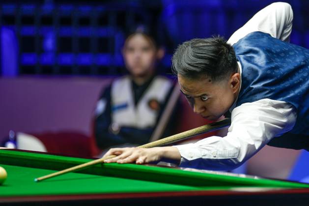 WUHAN, CHINA - AUGUST 24: Xiao Guodong of China plays a shot in the first round match against Mink Nutcharut of Thailand on day 1 of the 2025 Wuhan Open Qualifiers at Optics Valley Gymnasium of HUST on August 24, 2025 in Wuhan, Hubei Province of China. Copyright: xTaixChengzhex 111586616984