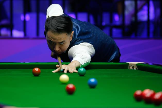 WUHAN, CHINA - AUGUST 24: Xiao Guodong of China plays a shot in the first round match against Mink Nutcharut of Thailand on day 1 of the 2025 Wuhan Open Qualifiers at Optics Valley Gymnasium of HUST on August 24, 2025 in Wuhan, Hubei Province of China. Copyright: xTaixChengzhex 111586616987