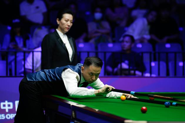 WUHAN, CHINA - AUGUST 24: Xiao Guodong of China plays a shot in the first round match against Mink Nutcharut of Thailand on day 1 of the 2025 Wuhan Open Qualifiers at Optics Valley Gymnasium of HUST on August 24, 2025 in Wuhan, Hubei Province of China. Copyright: xTaixChengzhex 111586616973