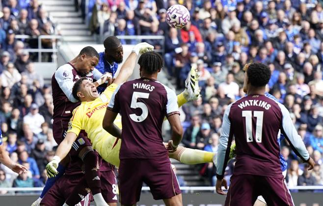 Liverpool, England, 13th September 2025. Emiliano Martinez of Aston Villa (C) falls under pressure from Dominic Calvert Lewin of Everton and Ezri Konsa of Aston Villa during the Everton vs Aston Villa Premier League match at Hill Dickinson Stadium, Liverpool. Picture credit should read: Andrew Yates Sportimage EDITORIAL USE ONLY. No use with unauthorised audio, video, data, fixture lists, club league logos or live services. Online in-match use limited to 120 images, no video emulation. No use in betting, games or single club league player publications. SPI_012_AY_EVERTON_VILLA SPI-4134-0011