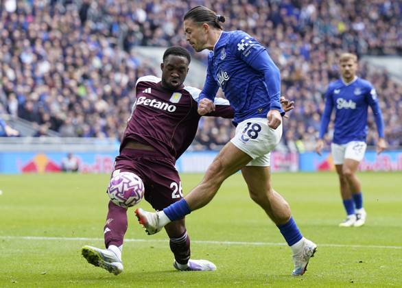 Liverpool, England, 13th September 2025. Jack Grealish of Everton (R) is challenged by Lamare Bogarde of Aston Villa during the Everton vs Aston Villa Premier League match at Hill Dickinson Stadium, Liverpool. Picture credit should read: Andrew Yates Sportimage EDITORIAL USE ONLY. No use with unauthorised audio, video, data, fixture lists, club league logos or live services. Online in-match use limited to 120 images, no video emulation. No use in betting, games or single club league player publications. SPI_029_AY_EVERTON_VILLA SPI-4134-0025