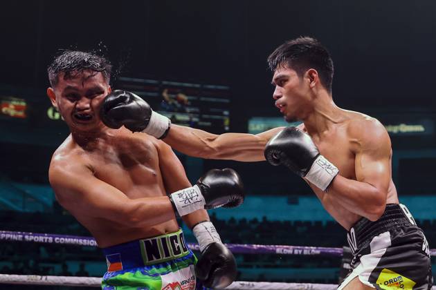 (251029) -- QUEZON CITY, Oct. 29, 2025 -- Eman Bacosa (R) of the Philippines competes against Nico Salado of the Philippines during the lightweight match at the Thrilla in Manila: 50th Anniversary in Quezon City, the Philippines on Oct. 29, 2025. ) (SP)PHILIPPINES-QUEZON CITY-BOXING-THRILLA IN MANILA 50TH ANNIVERSARY RouellexUmali 