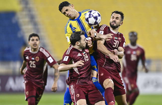 AFC CHAMPIONS LEAGUE ELITE, AL GHARAFA SC V AL WAHDA FC Jamal Hamed Mayor (C) of Al Gharafa SC and Sasa Ivkovic of Al Wahda FC in action during the AFC Champions League elite west football match between Qatar s Al Gharafa SC and United Arab Emirates Al Wahda FC at Thani Bin Jassim Stadium in Doha, Qatar on December 22, 2025. DOHA Qatar Copyright: xNOUSHADxTHEKKAYILx