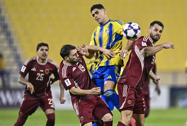 AFC CHAMPIONS LEAGUE ELITE, AL GHARAFA SC V AL WAHDA FC Jamal Hamed Mayor (C) of Al Gharafa SC and Sasa Ivkovic of Al Wahda FC in action during the AFC Champions League elite west football match between Qatar s Al Gharafa SC and United Arab Emirates Al Wahda FC at Thani Bin Jassim Stadium in Doha, Qatar on December 22, 2025. DOHA Qatar Copyright: xNOUSHADxTHEKKAYILx