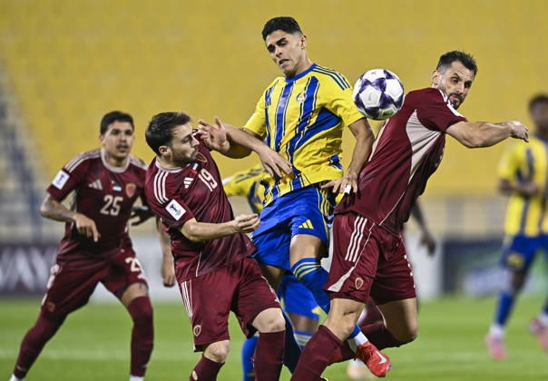 AFC CHAMPIONS LEAGUE ELITE, AL GHARAFA SC V AL WAHDA FC Jamal Hamed Mayor (C) of Al Gharafa SC and Sasa Ivkovic of Al Wahda FC in action during the AFC Champions League elite west football match between Qatar s Al Gharafa SC and United Arab Emirates Al Wahda FC at Thani Bin Jassim Stadium in Doha, Qatar on December 22, 2025. DOHA Qatar Copyright: xNOUSHADxTHEKKAYILx