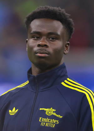 Milan, Italy, 20th January 2026. Bukayo Saka of Arsenal FC looks on during the line up prior to the Internazionale vs Arsenal UEFA Champions League match at Giuseppe Meazza, Milan. Picture credit should read: Jonathan Moscrop Sportimage EDITORIAL USE ONLY. No use with unauthorised audio, video, data, fixture lists, club league logos or live services. Online in-match use limited to 120 images, no video emulation. No use in betting, games or single club league player publications. SPI_125_JM_INTER_ARSENAL_UCL SPI-4421-0125