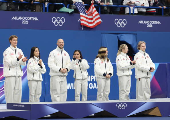 February 8, 2026, Milan, Lombardy, Italy: EVAN BATES, MADISON CHOCK, DANNY O SHEA, ELLIE KAM, ALYSA LIU, AMBER GLENN and ILIA MALININ of Team USA celebrate winning the gold medal during the Victory Ceremony of the Figure skating, Eiskunstlauf Team Event at the Milano Cortina 2026 Winter Olympic Games, Olympische Spiele, Olympia, OS Milan Italy - ZUMAc179 20260208_oly_c179_142 Copyright: xMickaelxChavetx