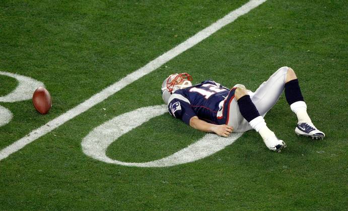 Feb. 3, 2008 - New England Patriots quarterback Tom Brady lays on the field after being sacked in the third qurter of Super Bowl XLII at University of Phoenix Stadium in Glendale, Arizona, on Sunday, February 3, 2008. (Jim Prisching MCT) Copyright: xJimxPrischingx