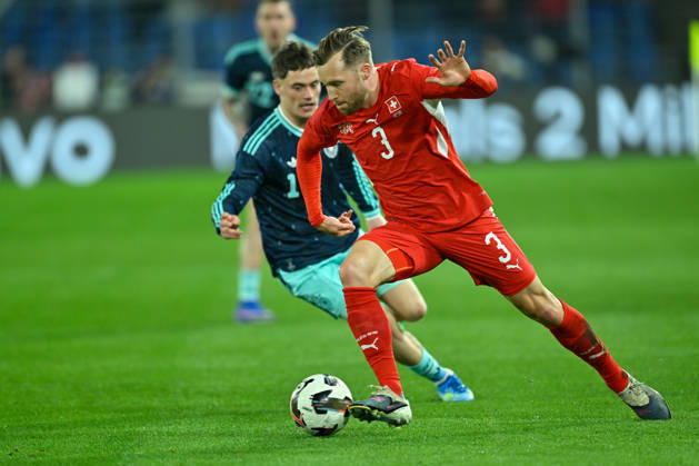 Basel, St.Jakob-Park, 27.03.26, GER, Herren, Laenderspiel: Schweiz - Deutschland Bild: v.li. im Zweikampf Florian WIRTZ (Deutschland) und Silvan WIDMER (Schweiz) UEFA regulations prohibit any use of photographs as image sequences and or quasi-video. Basel Schweiz