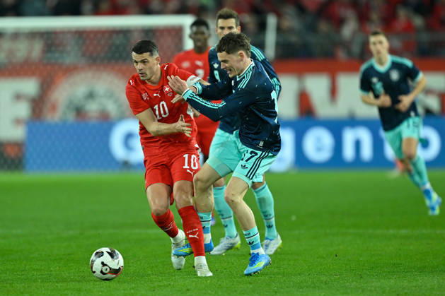 Basel, St.Jakob-Park, 27.03.26, GER, Herren, Laenderspiel: Schweiz - Deutschland Bild: v.li. im Zweikampf Granit XHAKA (Schweiz) und Florian WIRTZ (Deutschland) UEFA regulations prohibit any use of photographs as image sequences and or quasi-video. Basel Schweiz
