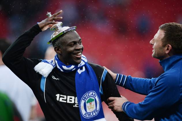 May 11, 2013 - London, England, United Kingdom - Wigan s AROUNA KONE (L) celebrates winning the FA Cup with the lid of the trophy on his head after the Manchester City v Wigan Athletic FA Cup Final at Wembley Stadium. Copyright: xAlexxMortonx