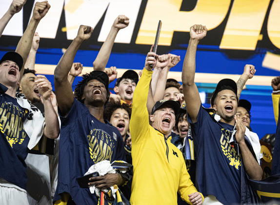 April 6, 2026, Indianapolis, Indiana, USA: Michigan head coach Dusty May celebrates with his team after defeating the UConn Huskies for the NCAA, College League, USA Mens Basketball Championship, 69-63. Monday, April 7, 2026. Indianapolis USA - ZUMAr44_ 20260406_zsp_r44_003 Copyright: xThomasxJ.xRussox