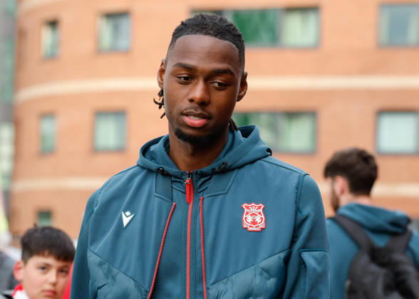 Wrexham, Wales, 7th April 2026. Arthur Okonkwo of Wrexham arrives ahead of the Wrexham vs Southampton Sky Bet Championship match at the SToK Cae Ras, Wrexham. Picture credit should read: Cody Froggatt Sportimage EDITORIAL USE ONLY. No use with unauthorised audio, video, data, fixture lists, club league logos or live services. Online in-match use limited to 120 images, no video emulation. No use in betting, games or single club league player publications. SPI_007_CF_WREXHAM_V_SOUTHAMPTON SPI-4671-0005