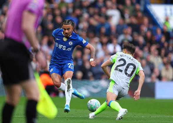 12th April 2026; Stamford Bridge, Chelsea, London, England: Premier League Football, Chelsea versus Manchester City; Malo Gusto of Chelsea under pressure from Bernardo Silva of Manchester City JPxFletcher