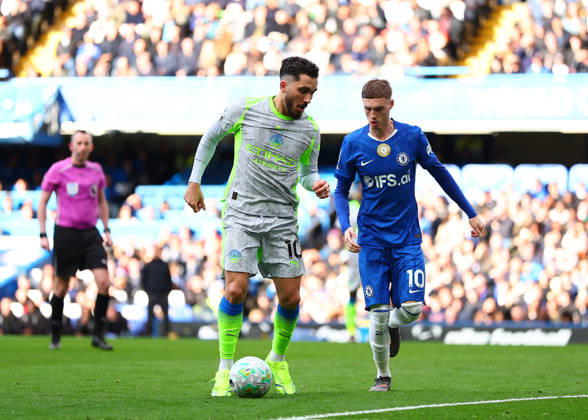 12th April 2026; Stamford Bridge, Chelsea, London, England: Premier League Football, Chelsea versus Manchester City; Rayan Cherki of Manchester City under pressure from Cole Palmer of Chelsea JPxFletcher