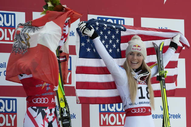 Feb. 3, 2015 - Beaver Creek, Colorado, U.S - LINDSEY VONN of the United States (right), laughs as she watches ANNA FENNINGER of Austria (left), wrap the Austrian flag around herself during the podium ceremony for the Ladies Super G during the FIS Alpine World Ski Championships. VONN finished in third place, while FENNINGER finished in first place. Copyright: xJasonxConnollyx