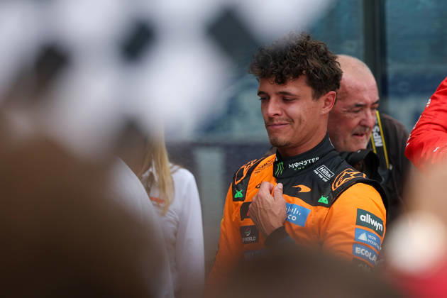 RECORD DATE NOT STATED 2nd May 2026; Miami International Autodrome, Miami, Florida, United States of America; 2026 FIA Formula 1 Miami Grand Prix; Sprint Race; Lando Norris (1) of Great Britain and McLaren Mastercard F1 Team after winning the Sprint Race with a fan waiving a checkered flag in the foreground DavidxBuono