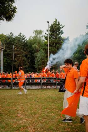 10.07.24, Football, UEFA EURO, EM, Europameisterschaft,Fussball 2024, Netherlands Fan March Netherlands supporters in orange walk along the fan march route in Dortmund, Germany, as smoke from a flare rises above the crowd before the UEFA Euro 2024 semi-final against England. Dortmund Dortmund NRW Germany
