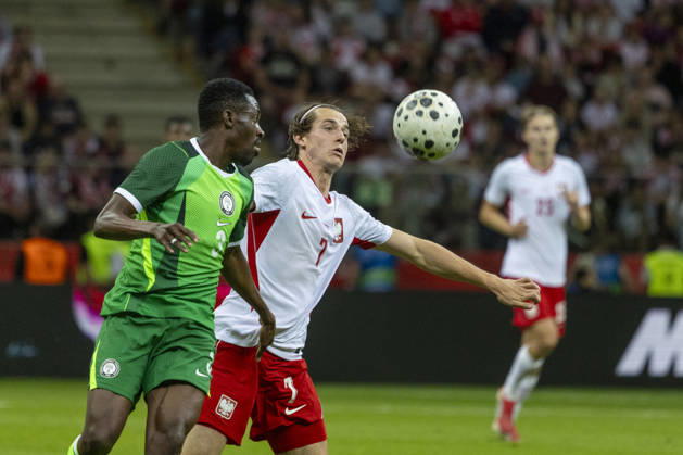 Fußball, Testspiel, Polen - Nigeria #4 Poland - Nigeria 03.06.2026 football, Warsaw, PGE National Stadium, FIFA , friendly international game match Poland - Nigeria ( mecz towarzyski, pilka nozna, Polska - Nigeria ) image shows: Zaidu Sanusi (L) Jakub Kaminski (R) photo Katarzyna Plewczynska Fotostyk Copyright: xKatarzynaxPlewczynskax 20260603FCTKPKAPL7680